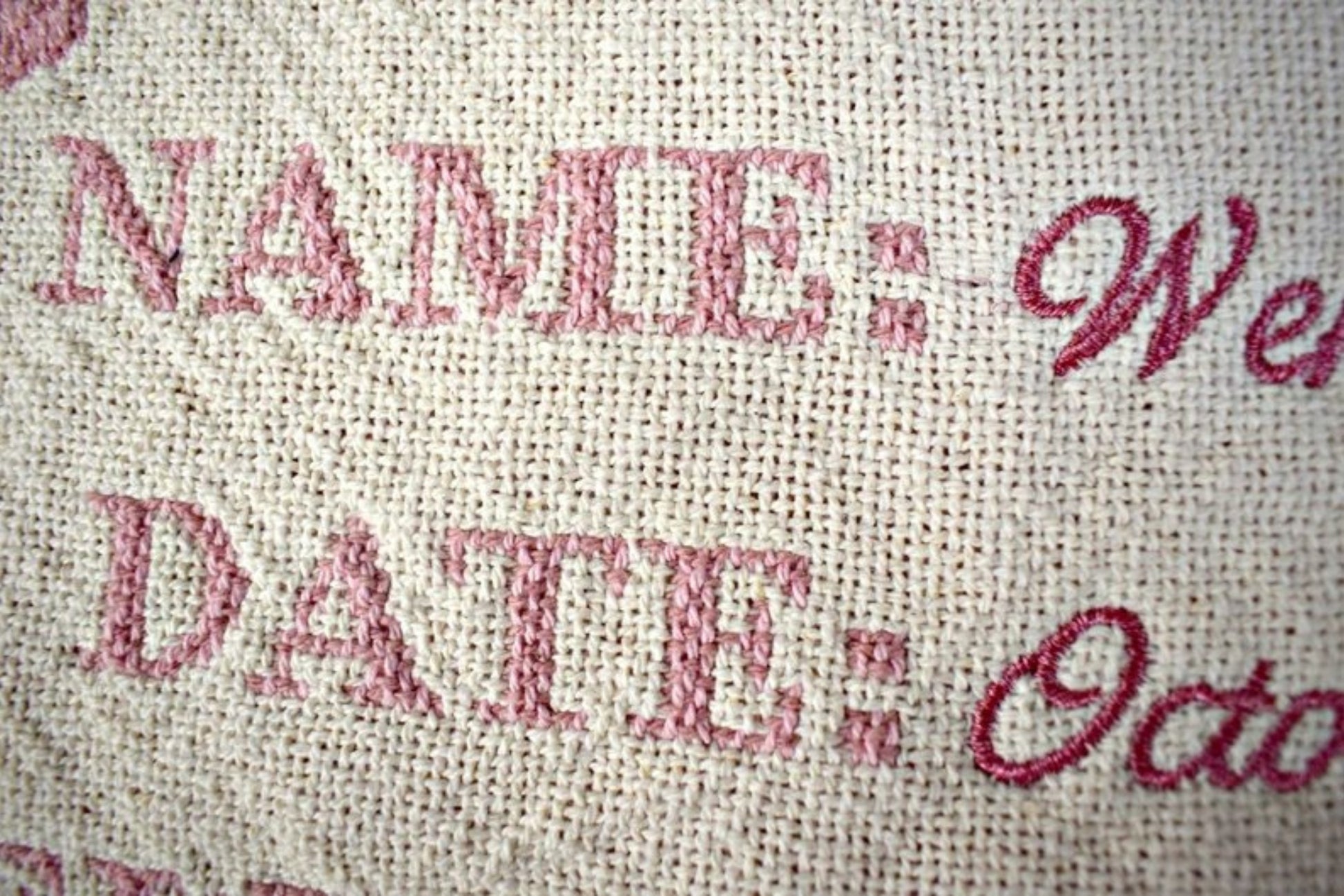 Textured fabric with printed text including 'NAME:', 'DATE:', and 'October' in red.